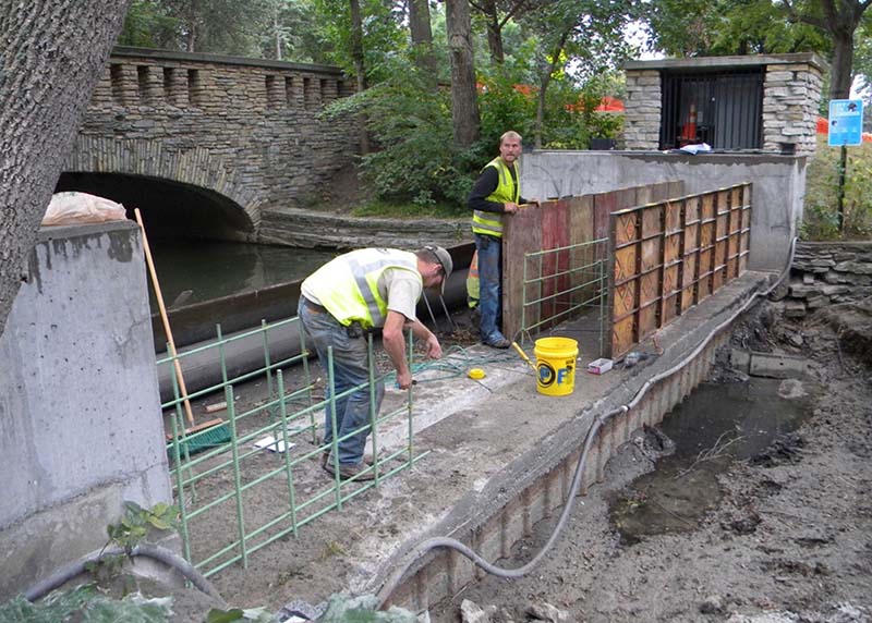 working on the weir at Lake Nokomis